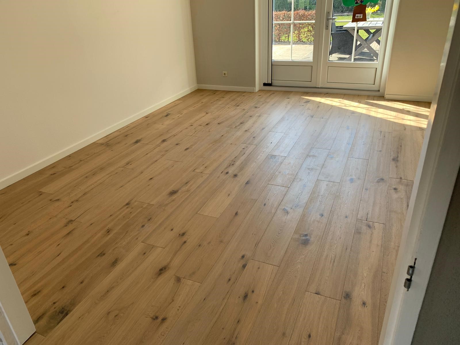 Houten vloer en vloerverwarming in Assen